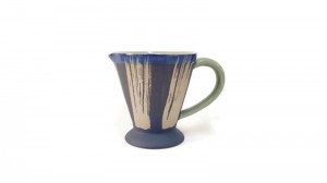 Pitcher with ground coffee design